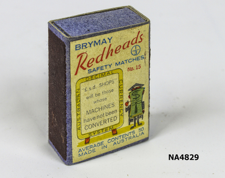Empty match box. Drawing of a stylised teacher on right hand side in shades of green red and black, with black board beside him. 
