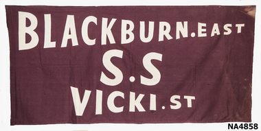 Maroon cloth banner with white felt letters