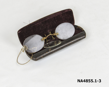 Small dark brown leather glasses case With maroon velvet inside