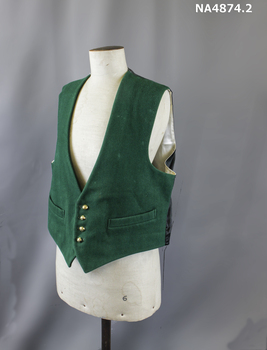 Waistcoat of green woollen velvet like material with black satin back and oyster satin lining