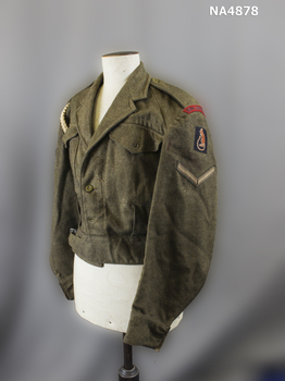 Short khaki blouse style jacket. 