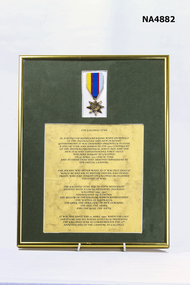 Brass metal frame with a green background.