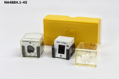 Case, yellow top with Kodak logo. Opaque container with 40 slides in total