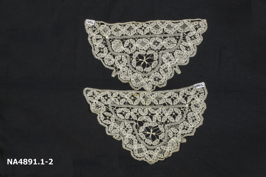 Two cream coloured machine made lace triangular tea cosy pieces. 