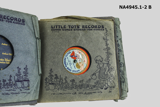 Two card board/paper books containing 2 vinyl records of children's songs, games and stories. 