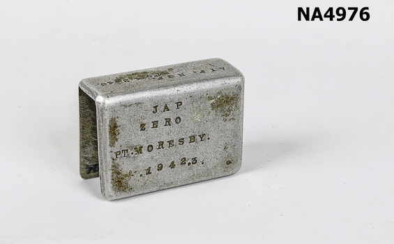 Aluminium matchbox holder made from part of Japanese Zero aeroplane. 