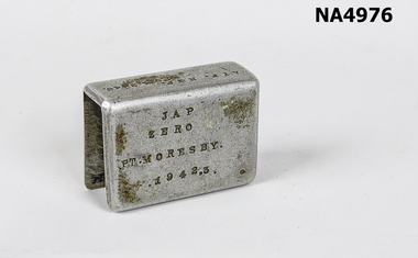 Aluminium matchbox holder made from part of Japanese Zero aeroplane. 