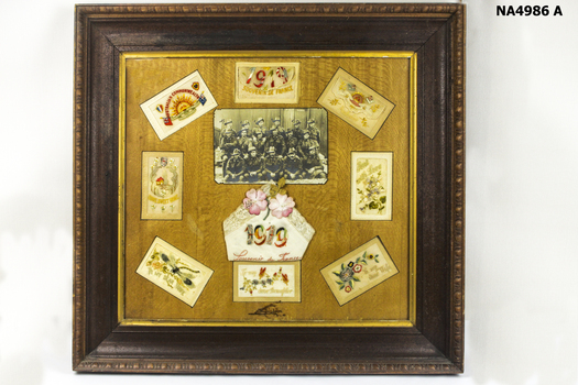 Large wooden picture with eight souvenir postcards fron France 1919.  