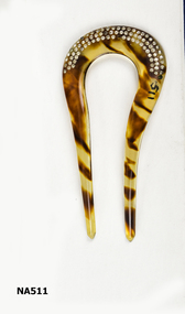 Curved tortoiseshell decorative hair comb with two long prongs.