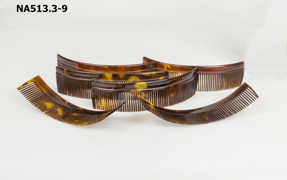 Water Wave Set comprising:  1 dish, 6 curved combs, 1 packet pins, 1 box containing hair net and 13 large hair pins. A total of 22 items.