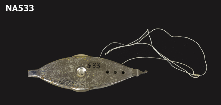 Spool used for tatting or lace making.