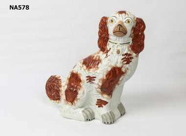 Staffordshire dog - no makers mark.  Right foot cracked.  Repair on ear.  Some cracks on body.