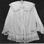 Long white lawn bed jacket pin tucked with lace insets on sleeves and body. 
