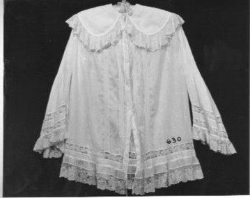 Long white lawn bed jacket pin tucked with lace insets on sleeves and body. 