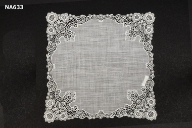 White lawn handkerchief with deep lace border