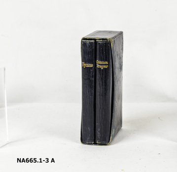 Small black leather case containing black leather covered hymn book and common prayer book.