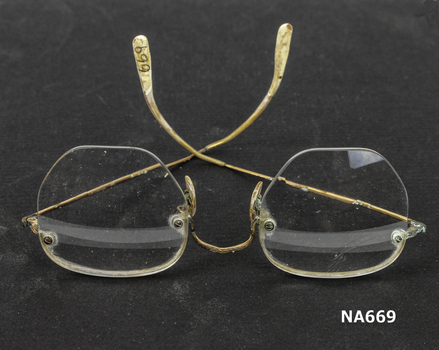 Wire framed spectacles with bifocal lens