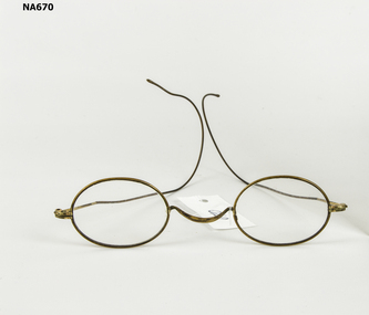 Small pair wire framed spectacles.