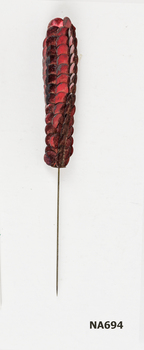 Hat pin with red sequins