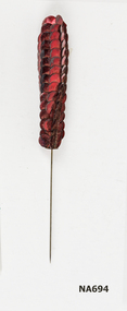 Hat pin with red sequins
