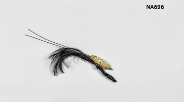 Hat decoration with white sequins and black feathers