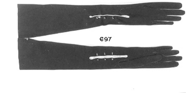 Pair of long black suede gloves with three buttons at wrist. 