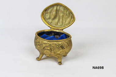 Gold coloured metal jewellery box with roses etched on lid and sides.
