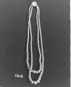 Graduated double pearl necklace with large pearl as clasp