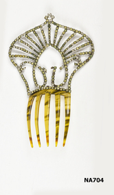 Five pronged comb with high jeweled top