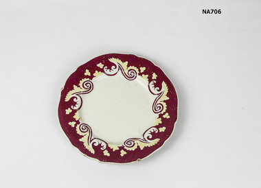 China plate with red and yellow decoration on border, 