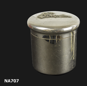 silver tin with 'powder' engraved on lid