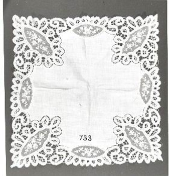 White lawn handkerchief with deep lace insets at corners