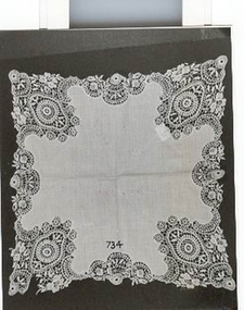 White lawn handkerchief with deep net lace insets at corners
