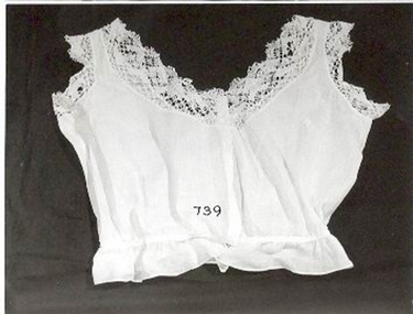 Physical description  White lawn bust bodice with Torchon lace at V neck line and sleeves. 