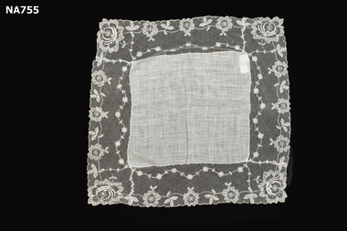 White lawn handkerchief and lace border.