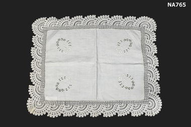 White cotton tray cloth with crocheted lace border and embroidered garlands 