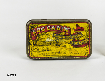 Yellow tobacco tin with illustration log cabin man, and horses. 