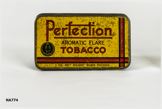 Yellow Tobacco tin  'Perfection Aromatic Flake Tobacco' written in red.