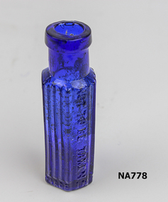 Small blue glass bottle