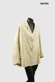 Cream silk riding coat with two large self covered buttons. 