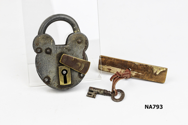 Large metal ornamental padlock with key. Has sliding piece to cover lock when key not in place