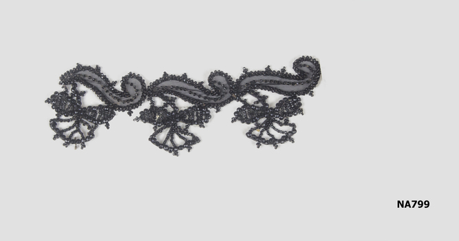 Piece of black beaded lace