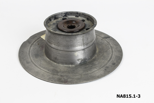 Pewter ink well stand - large round base with centrepiece for inkwell and holes for pens. Bakelite and pen included.