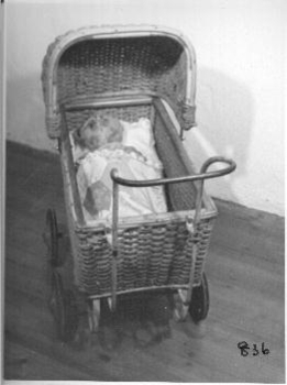 Wicker toy pram with iron handle