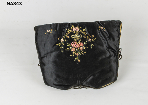 Black satin tea cosy hand embroidered in grub stitch with pink roses and cording in gold thread. Black cord Trim lined in cream silk