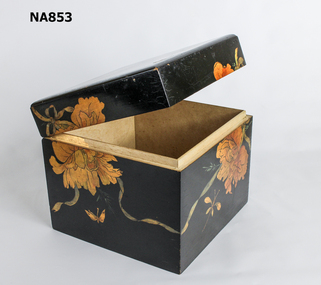 Brown lacquered box with light tan flower, butterflies and bees transfers. Split on base . hinged lid. No pattern on back