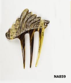 Tortoise shell comb three prongs.