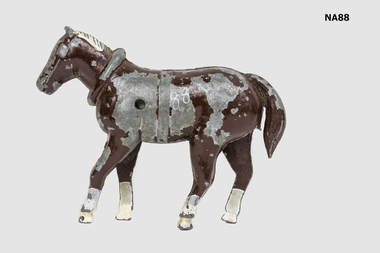 Brown painted horse with white mane and white feet.