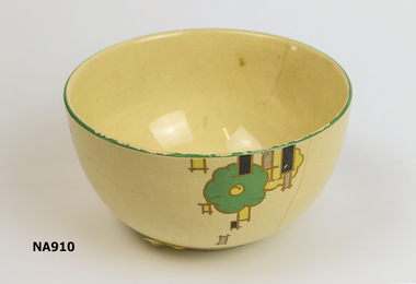 Round cream bowl with green, yellow and black design