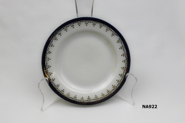  White porcelain bread and butter plate with gold and dark blue border